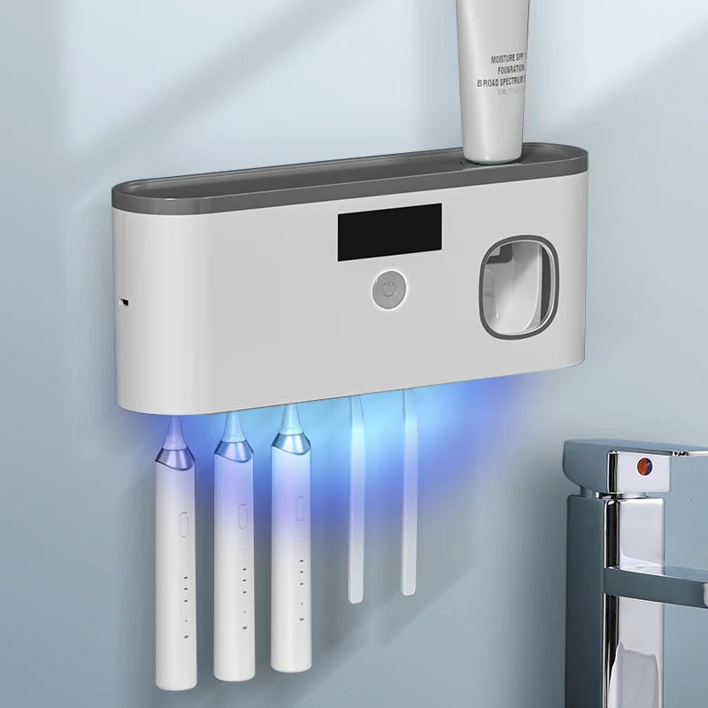 Intelligent UV toothbrush sterilizer with automatic toothpaste dispenser .